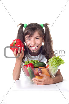 beautiful little girl with vegetables 