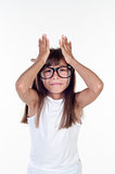 Portrait of a funny surprised girl in glasses