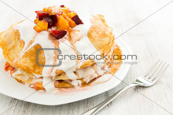 Crepes with fruit and cream