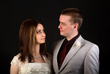 bride and groom on a black background