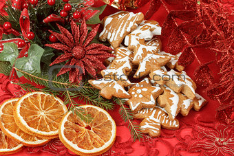 christmas background with needles. orange slices and gingerbreads