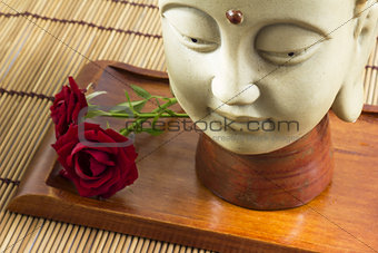 Buddha with rose