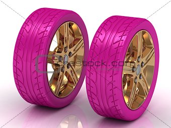 2 pink wheels with a gold disc