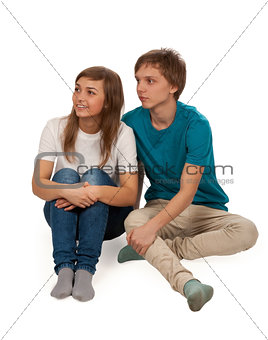 boy and girl sitting on the floor