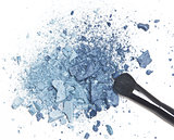 Crushed blue eyeshadow with makeup brush