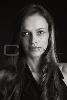 Beautiful young woman in dark background
