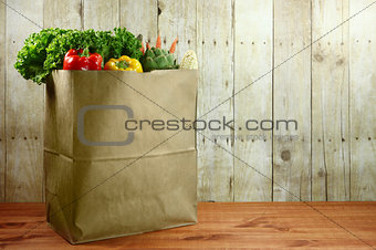 Bag of Grocery Produce Items on a Wooden Plank