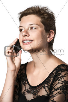 Girl phoning with cellphone in the evening dress