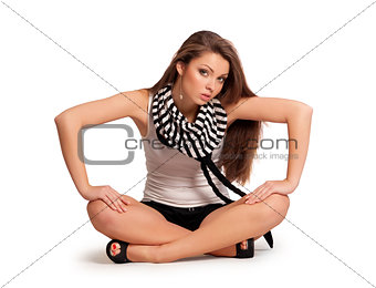 pretty young girl in a blouse sitting on the floor