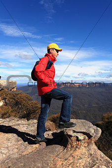 Bushwalker hiker looking out over mountain valley views