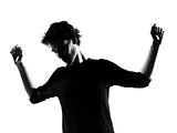 young man silhouette dancing happy