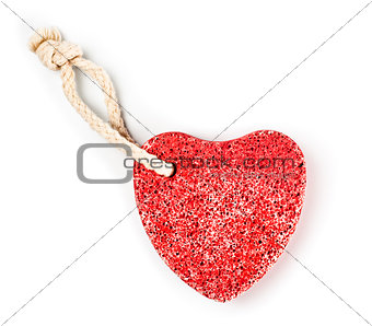 red heart-shaped stone with rope