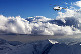 Helicopter in winter mountains