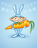 Happy little boy in rabbits costume with big carrot