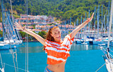Happy woman in yacht port