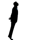 one business man silhouette tiptoe looking up