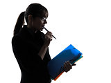 business woman focused  holding folders files silhouette