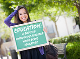 Mixed Race Female Student Holding Chalkboard With Education and 