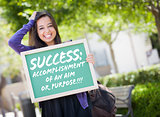 Mixed Race Female Student Holding Chalkboard With Success and De