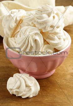 cookies meringue (whipped egg whites and sugar) on a wooden table