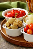 pickled snacks (tapas) - mushrooms, tomatoes, cucumbers and pearl onions