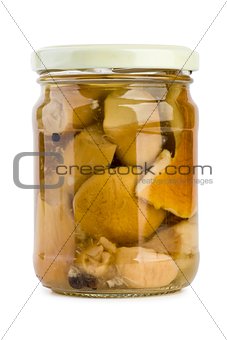 Glass jar with pickled cepe mushrooms