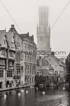 Bruges water canal and Belfry tower in monochrome