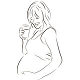 Pregnant woman with a glass of milk