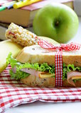 sandwich with ham, apple, banana and granola bar - healthy eating, school lunch