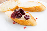 Slice of baguette with cherry jam