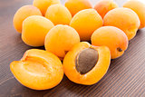 Fresh apricots on wooden table