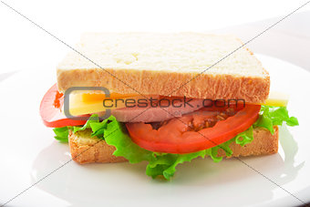 Sandwich with ham, cheese and tomato