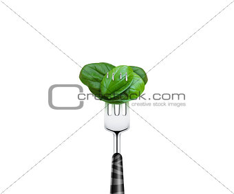 Tomato pierced by fork,  isolated on white background 
