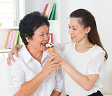 Women eating ice-cream cone