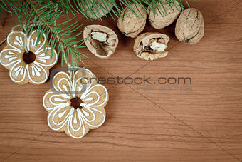 walnuts and gingerbread on wooden background