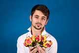 Man with bouquet of red roses