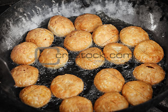 Indian pastries in a pan on the open market