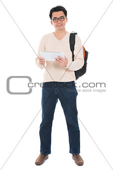 Full body Asian adult student using tablet pc