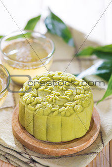 Green tea with red bean paste mooncake