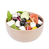 fresh greek salad in clay bowl