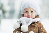 Portrait of happy baby in winter park