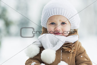 Portrait of happy baby in winter park