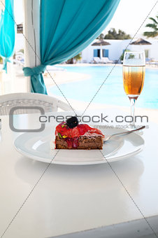 Cake with champagne in a pool