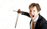 Crazy businessman attacking with sword