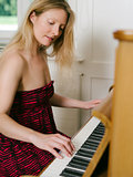 Adult female playing the piano