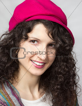Beautiful smiling brunette with curly hair