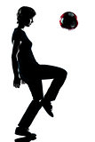 one young teenager boy silhouette juggling soccer football