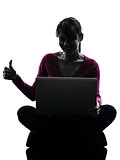 woman thumb up computing laptop computer silhouette