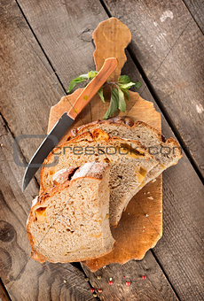 Bread with knife on a cutting board