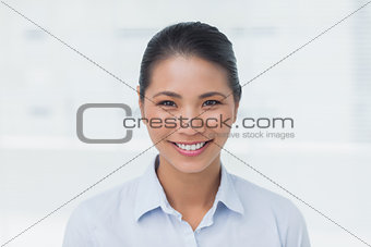 Happy businesswoman posing looking at camera